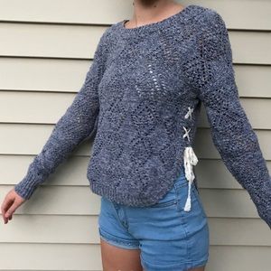 blue knit sweater with laced up sides